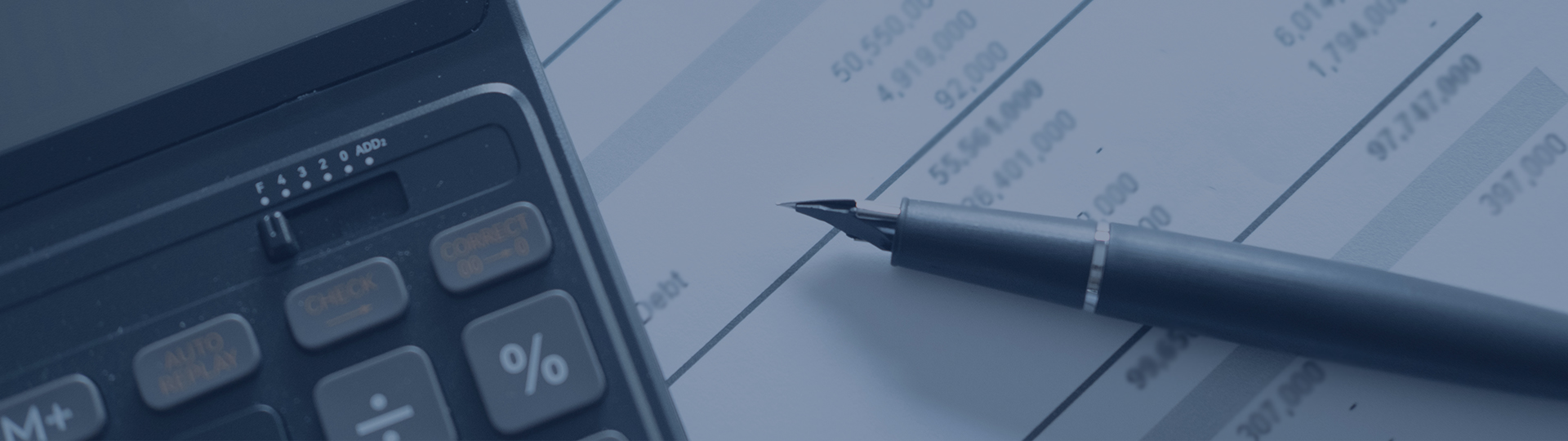 Pen and calculator on top of accounting paperwork