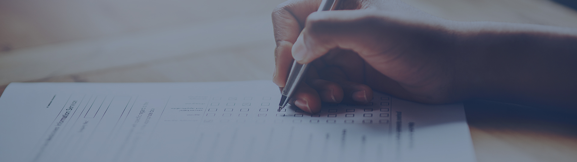 hand writing with a pen on paper