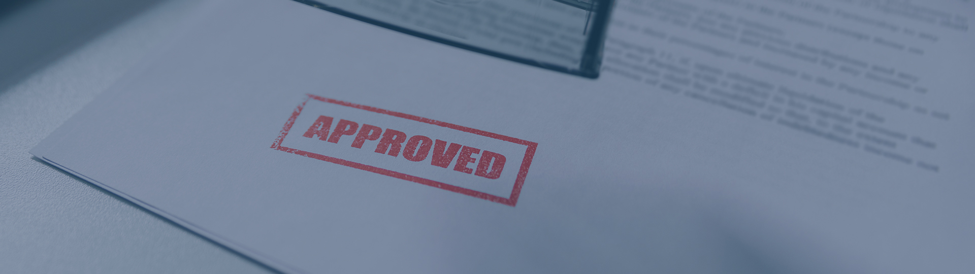 the word approved stamped onto white paper